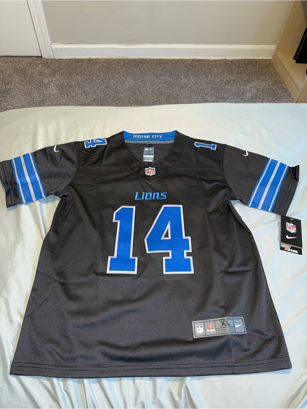 Kids Nike Black Football Jersey with Blue Collar Accents